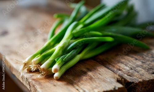 Close-up shot of raw, unpeeled green onions fresh from the garden on a well-worn wooden gardening table