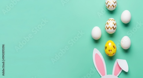 Easter eggs and bunny ears on pastel background