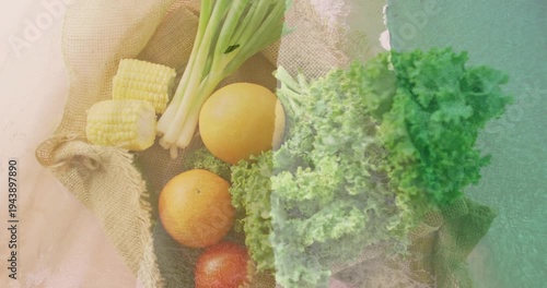 Burlap tray revealing produce showing kale corn overlay thinning and warming textures for culinary
