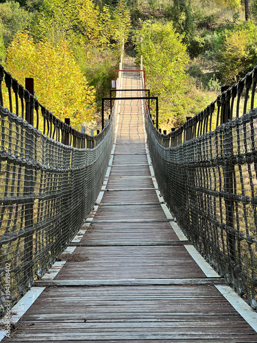 Wooden Bridge over a Valley