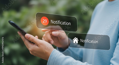 Hands holding a smartphone, interacting with notifications. Illustrating mobile connectivity and digital engagement.