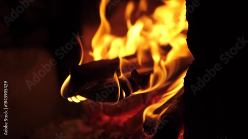 Wood burning in a fire close-up handle shot with shallow depth of field