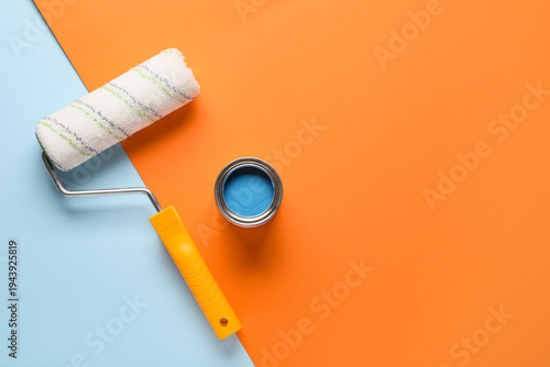Roller with can of blue pai...