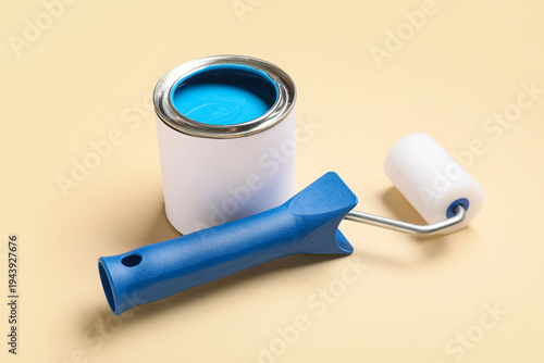 Can of paint with roller on...
