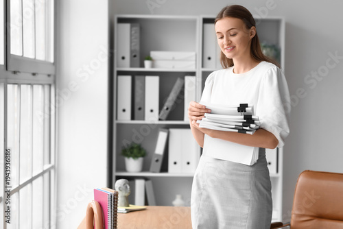Female secretary with files...