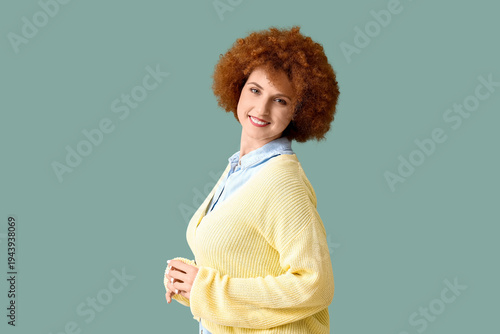 Redhead young woman with cu...