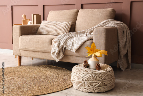 Comfortable sofa and pouf w...