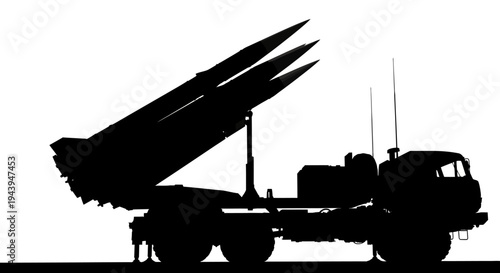 A black silhouette of a truck with missiles on the back