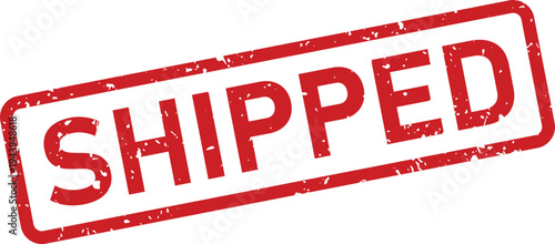 A distressed red grunge effect rubber stamp displaying the word SHIPPED on a bright white surface