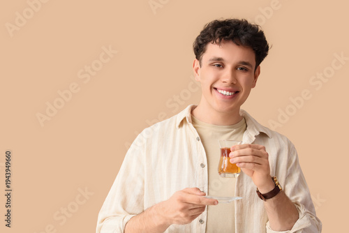 Young man with Turkish tea ...