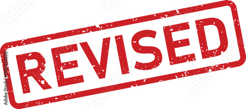 A distressed red rubber stamp featuring the word REVISED stands out against a bright white surface