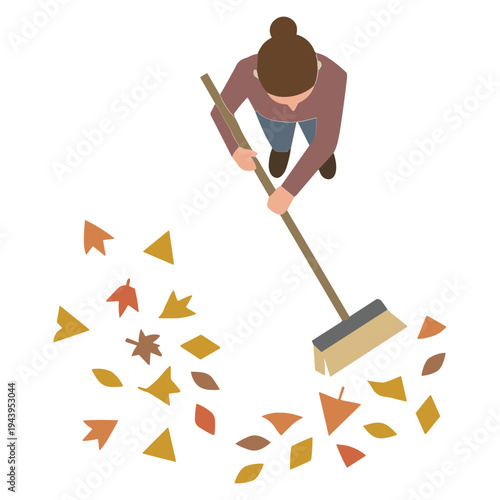 Woman sweeping leaves on a lawn with a broom outdoors