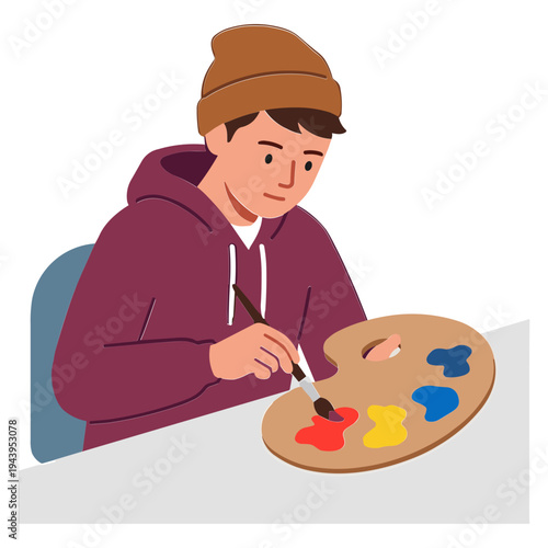 Artist sitting at desk painting with colorful palette and brush