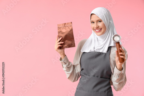 Happy young female barista ...