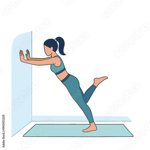 Woman performs yoga stretch against wall in fitness class indoors