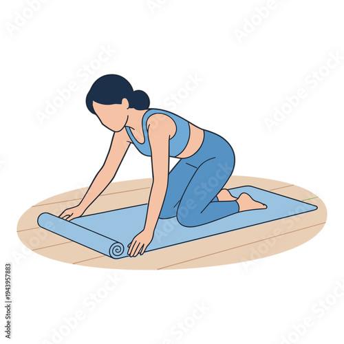 Woman rolls out yoga mat on wooden floor for exercise routine