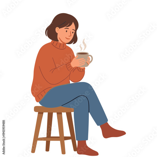 A woman sits on a stool holding a steaming mug of coffee warmly.