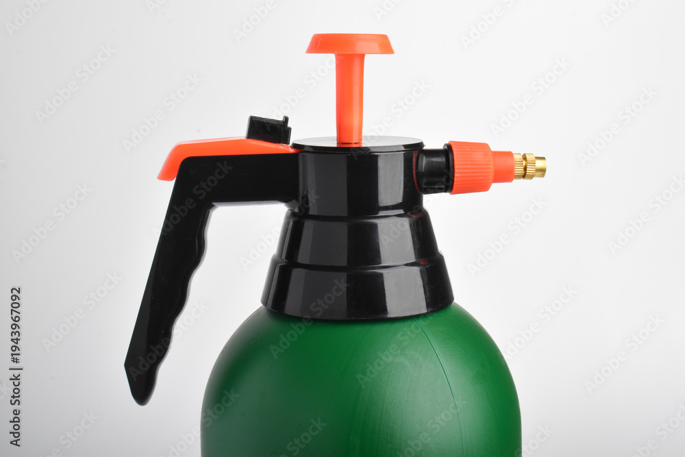 Naklejka premium Hand pressure garden sprayer isolated on white background.