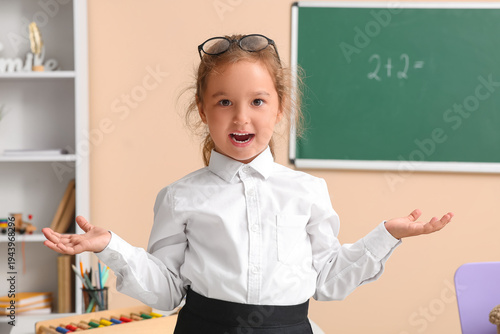 Cute little surprised teach...