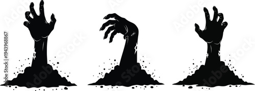 Creepy zombie hands rising from the ground