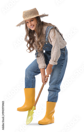 Cute teenage happy gardener with shovel digging on white background