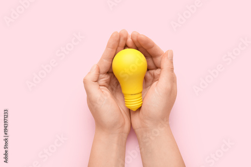 Female hands with yellow li...