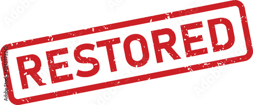 A vibrant red rectangular rubber stamp prominently features the word RESTORED with a textured grunge effect