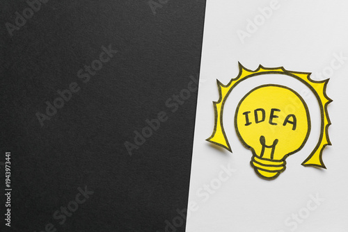 Paper light bulb with word ...