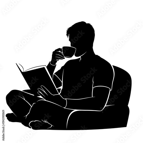 A man sitting on a chair reading a book and drinking coffee