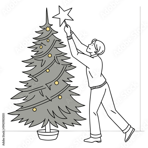 Man places star atop decorated holiday tree.