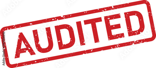 Red textured rectangular rubber stamp indicating financial records have been officially audited on a white surface
