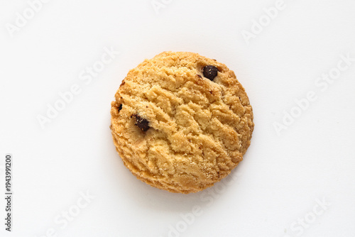 Fotografie One vanilla chocolate chip cookie isolated on white with a detailed, crumbly texture