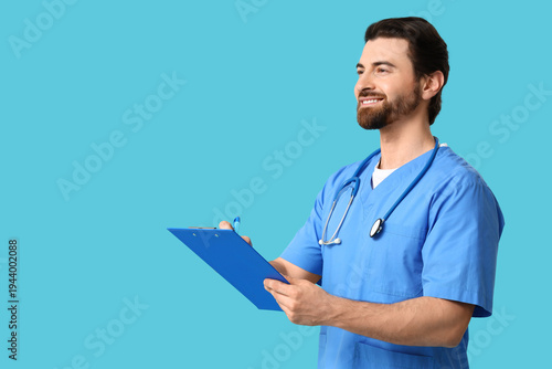 Young happy male doctor wit...