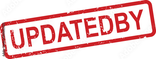 A distressed red rubber stamp clearly shows the single word UPDATEDBY on its surface against a bright white background
