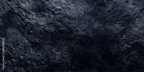 A dark blue grunge wall texture with a rough aged stone pattern and vintage paper material creates a blank textured backdrop for antique art design