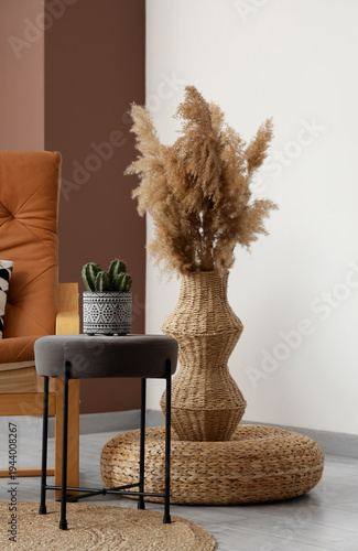 Stool, pouf and vase with p...