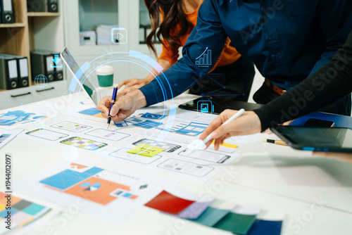 Innovative team planning UI UX mobile app interface with digital technology overlay, collaborating on data analytics, product design