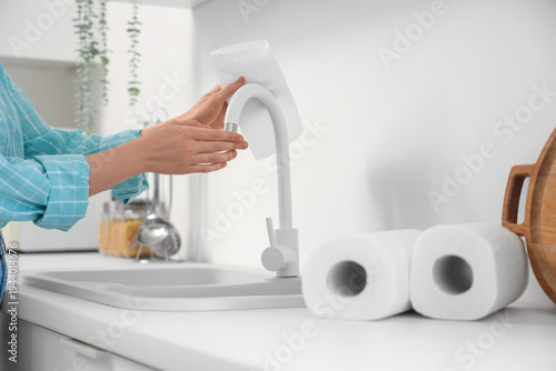 Young woman with rolls of p...