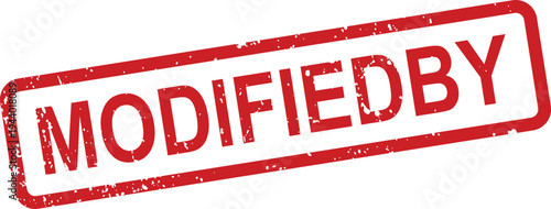 A red rectangular distressed rubber stamp clearly shows the bold uppercase text MODIFIEDBY
