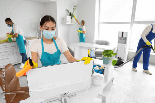 Female Asian janitor with m...