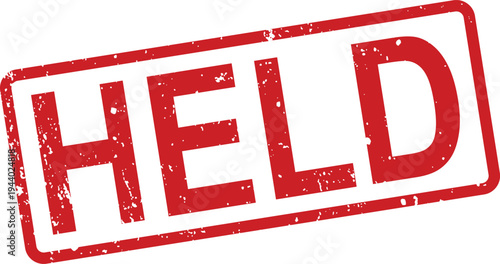 A striking red rectangular rubber stamp featuring the word HELD in distressed capital letters on a white background