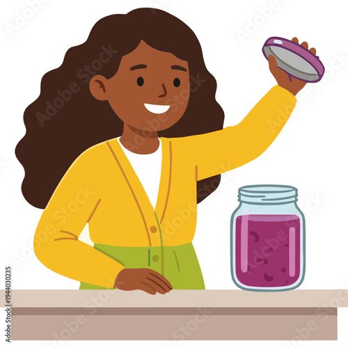 A girl holds up a lid next to a jar on a table.