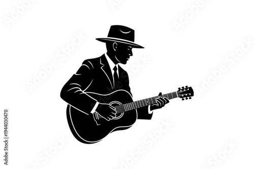 Silhouette of man in hat playing acoustic guitar in classic style