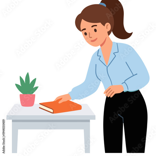Woman placing book on table with plant in office setting indoors.