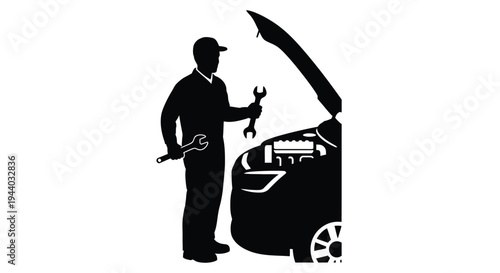 Silhouette of a mechanic working on the engine of a car