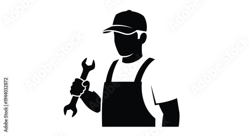 Silhouette of a worker holding a wrench wearing a cap and overalls
