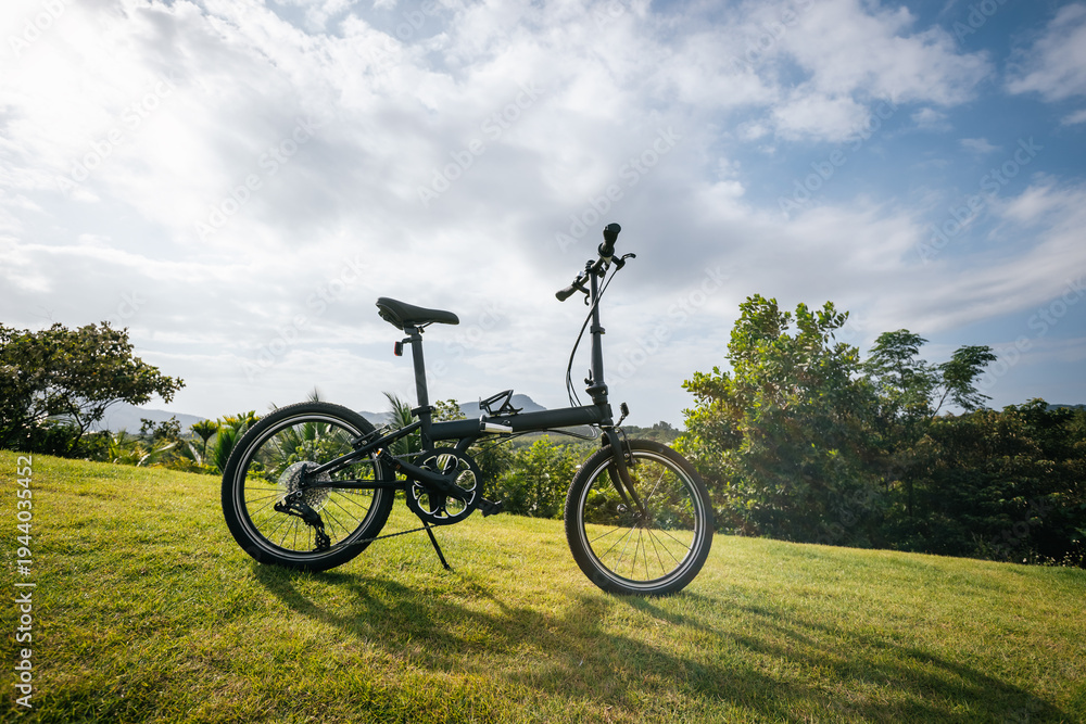 Fototapeta premium Folding bike on tropical mountain top