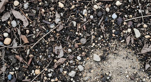 Rocky soil ground texture with mixed gravel and natural earth particles forming rough outdoor terrain background for environmental and construction design