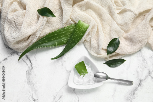 Bowl of aloe vera gel and l...
