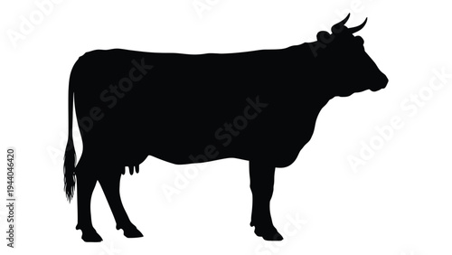 A black silhouette of a cow standing in profile against a white background, showcasing its distinctive horns and tail in a simple yet striking visual representation.